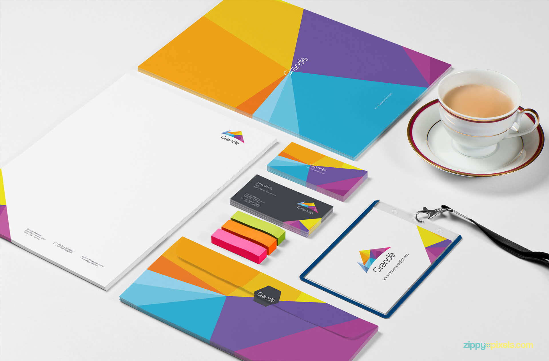 Stationery Branding Mokcup of Set of Letterheads, Business Cards, Envelopes, Id badge holder with Erasers & Tea Cup