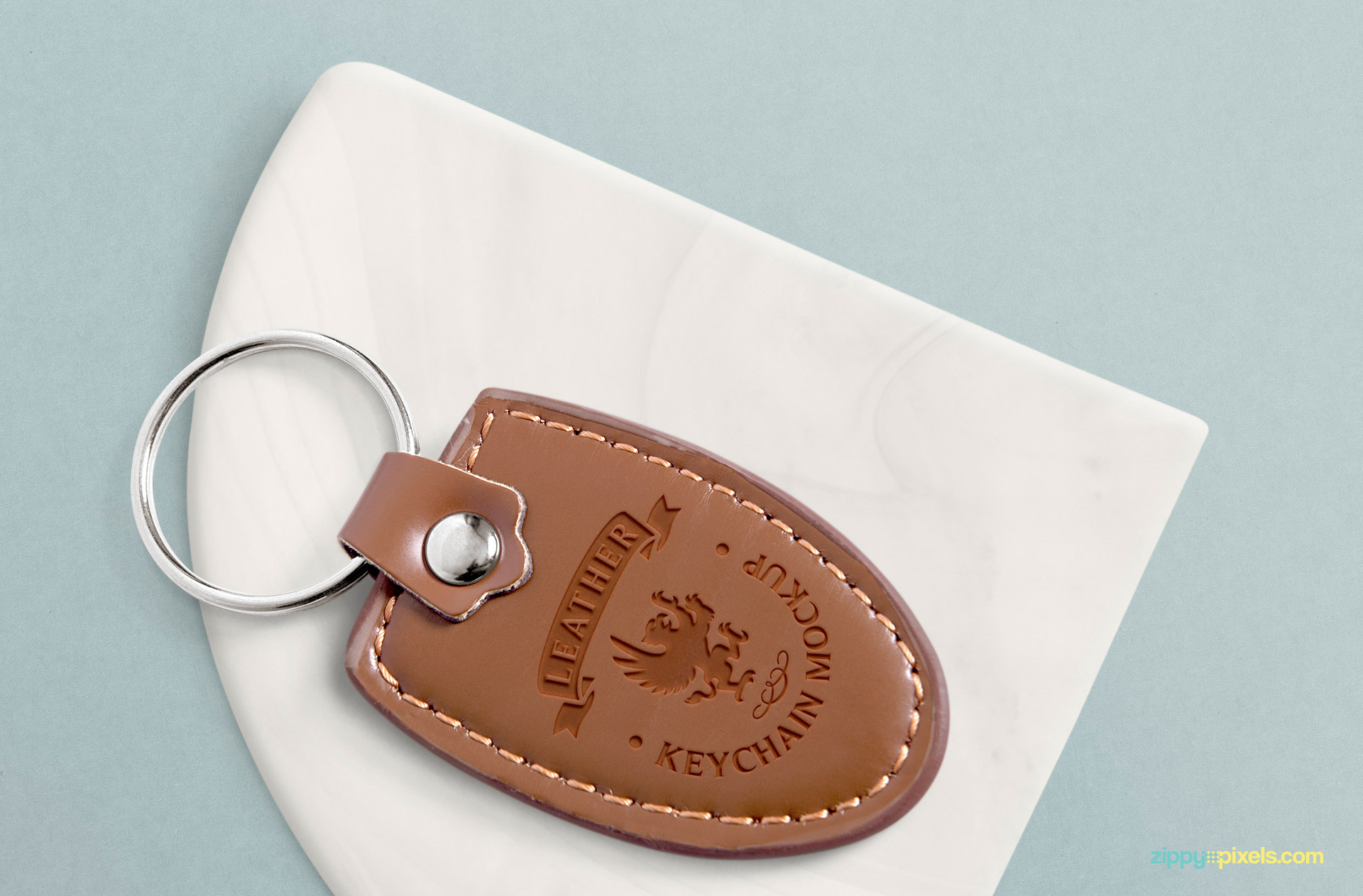 You can paste your design using Smart Object option of this keychain mockup.