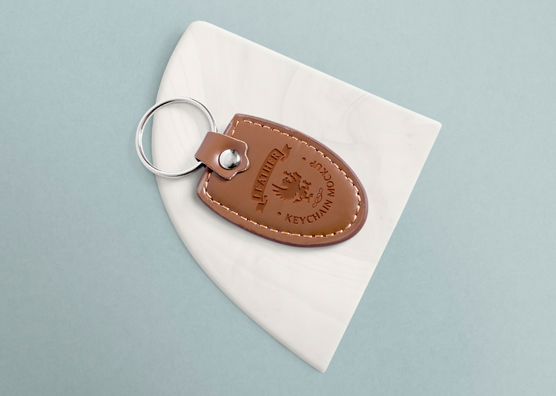 Free Leather Keychain Mockup with Changeable Marble Base | ZippyPixels