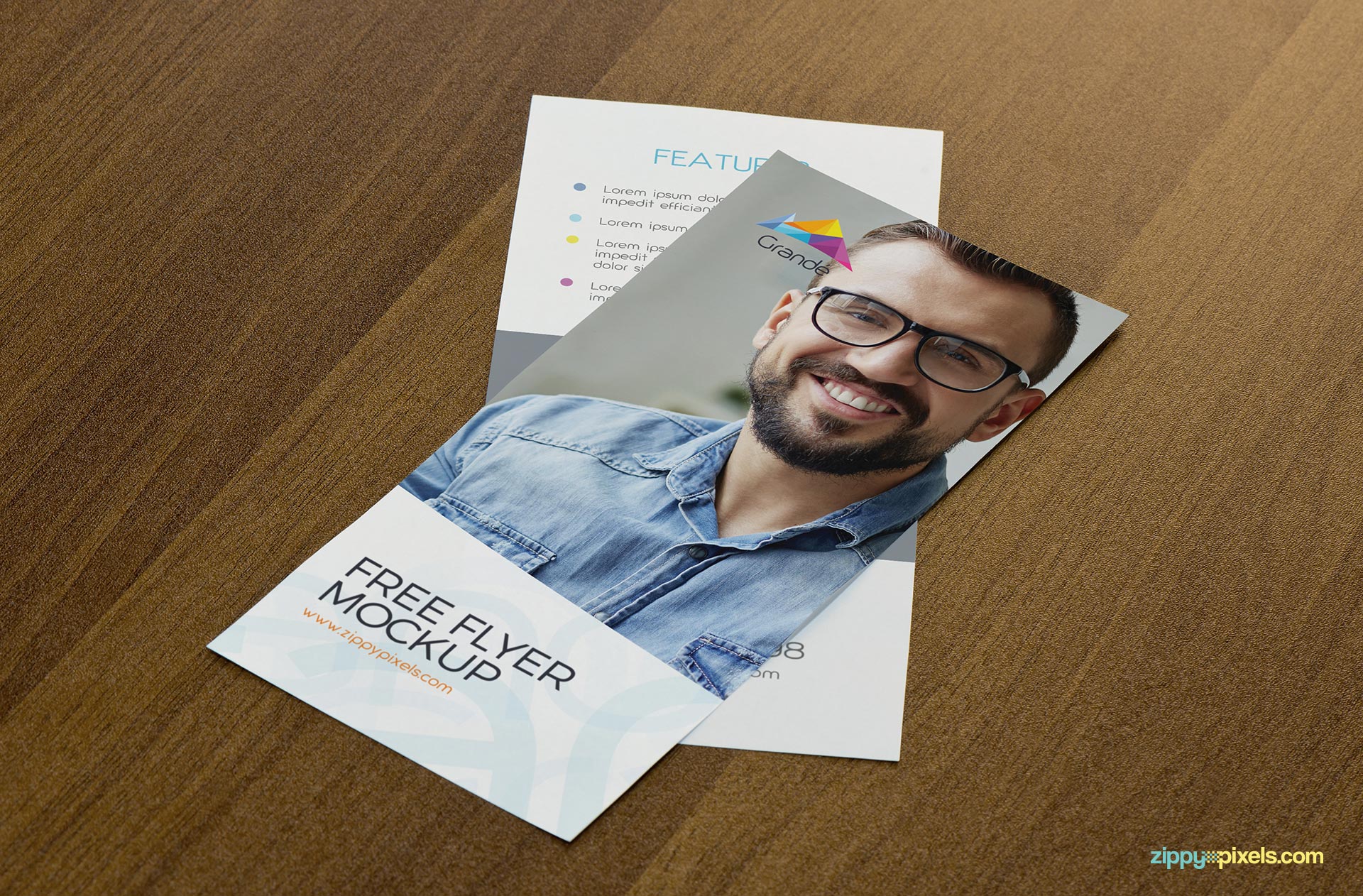 Free flyer mockup with wooden background.
