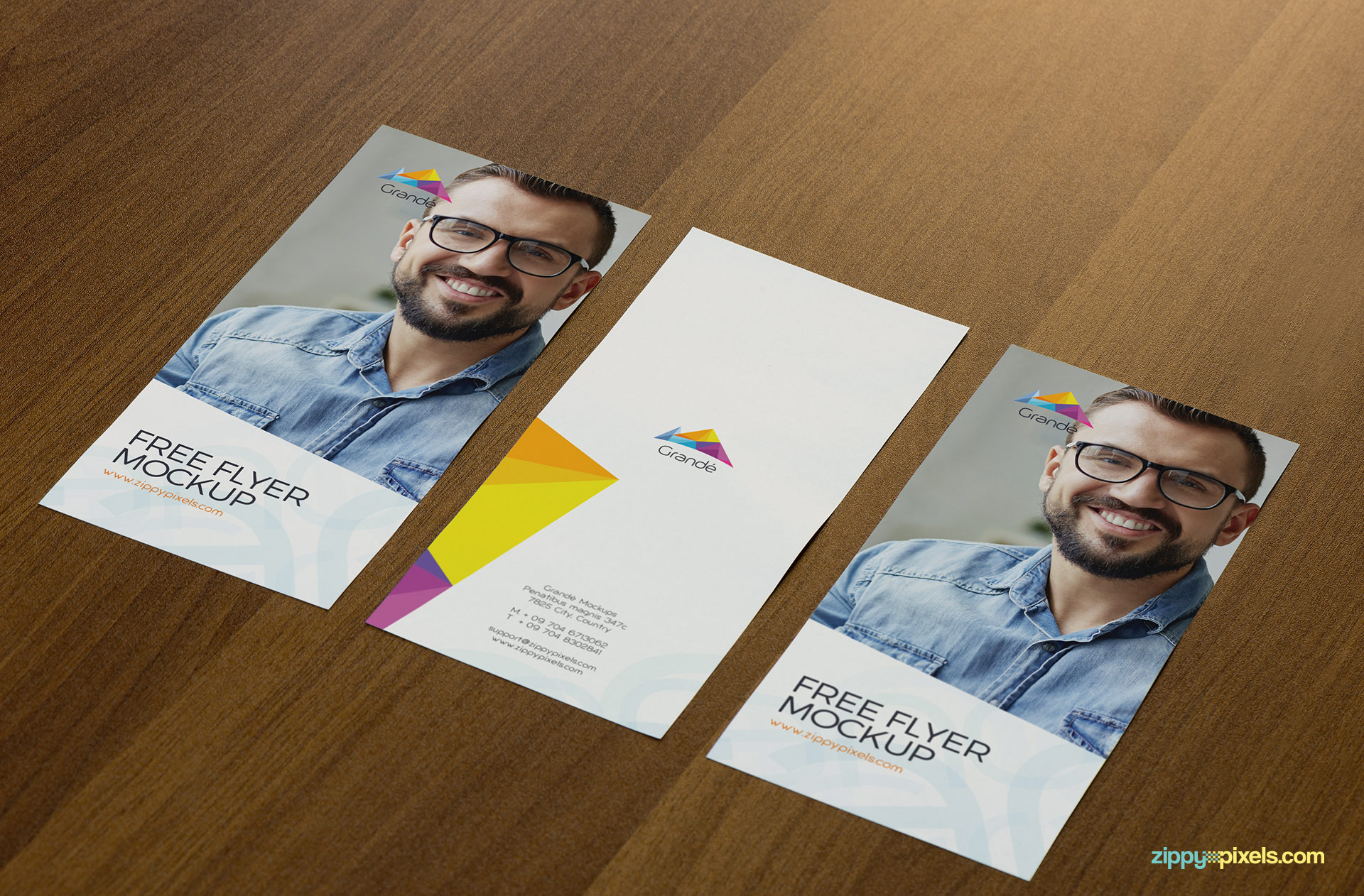 Free flyer mockup PSD with a wooden background.