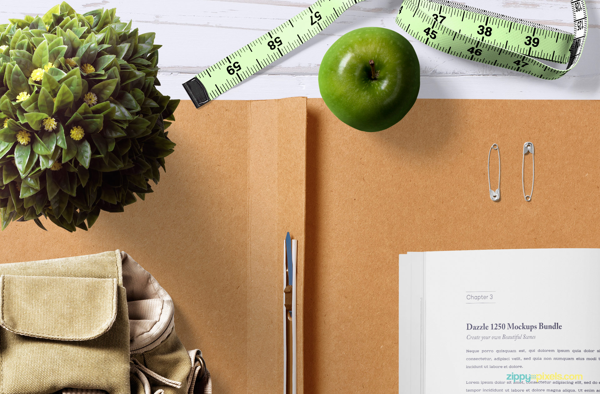 Free mockup scene including apple, plant pot, inches tape and file cover.