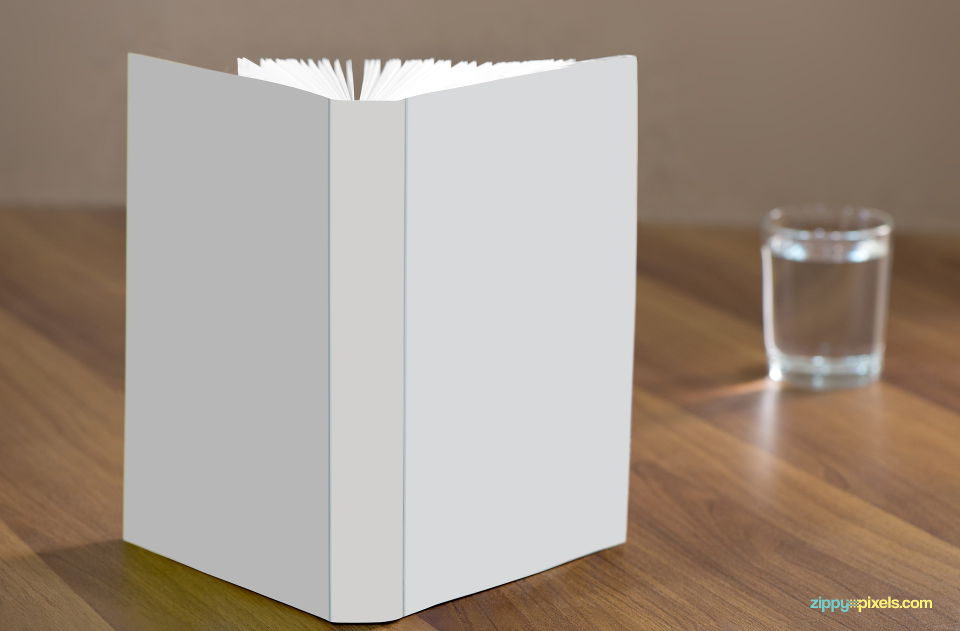 Use smart object in Photoshop to change the design of the book.