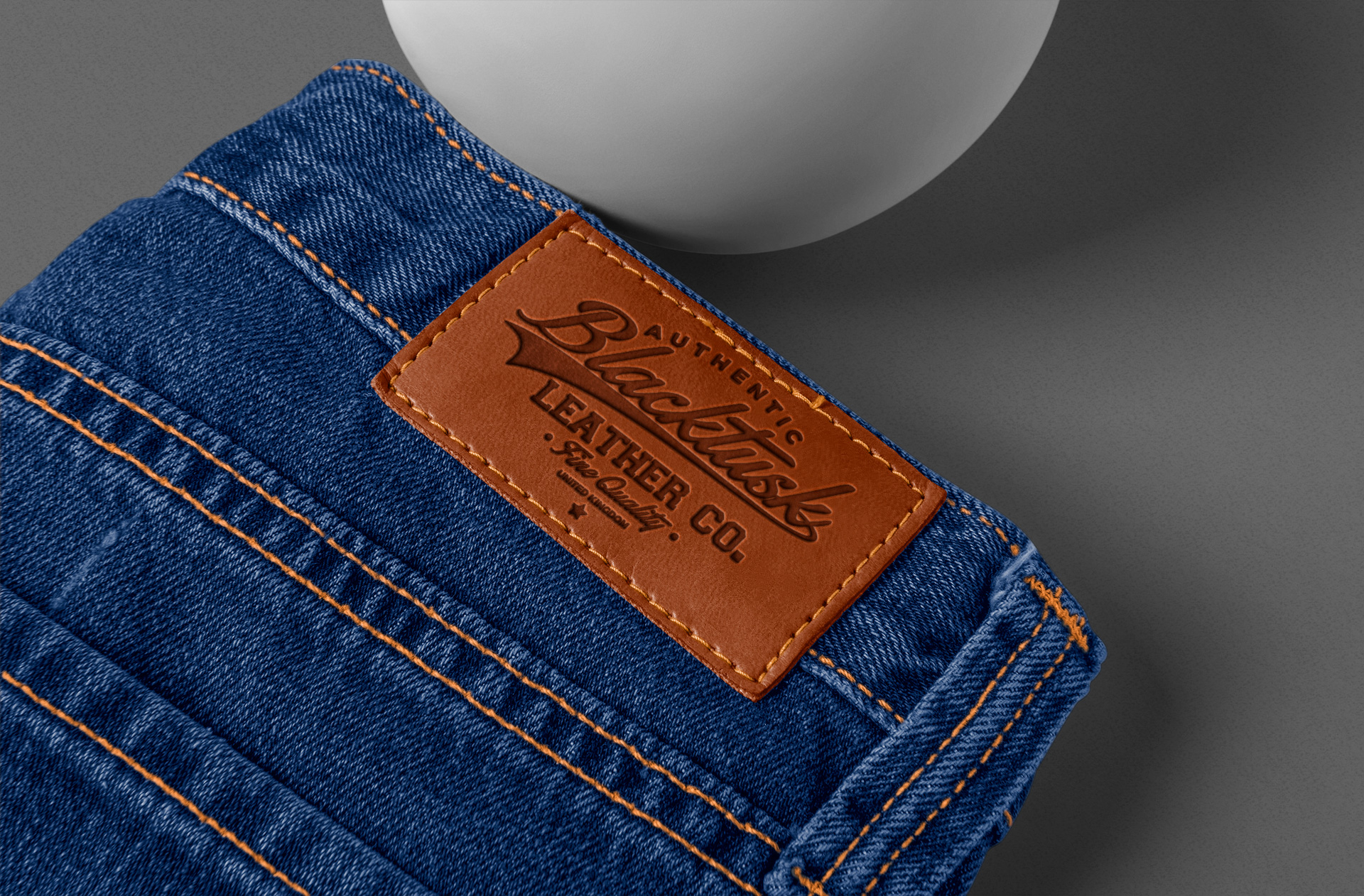 Leather Patch Logo Mockup on Denim Jeans – Angled View