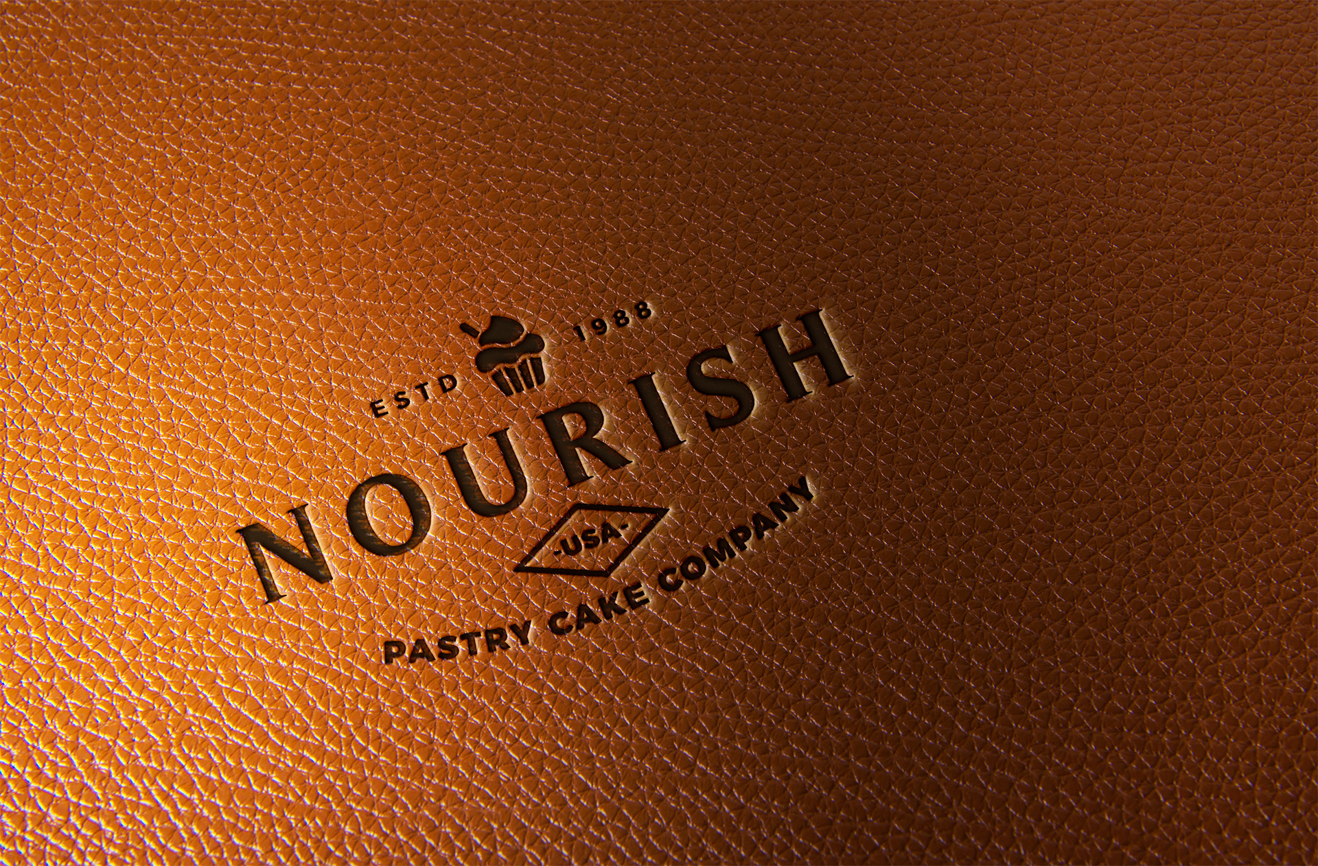 Debossed Logo Mockup on Tan Leather Surface