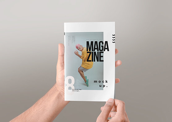 Vertical Magazine Mockup in Hand View