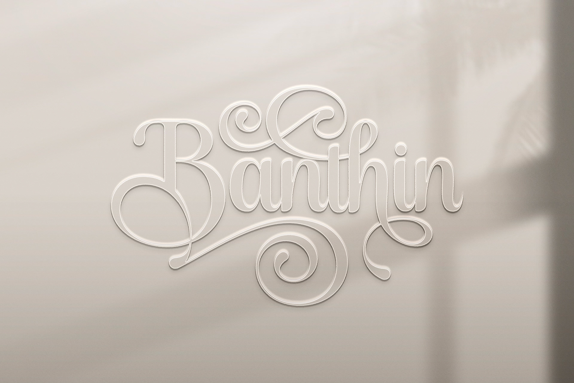 Elegant Plastic Script Logo Mockup on Wall